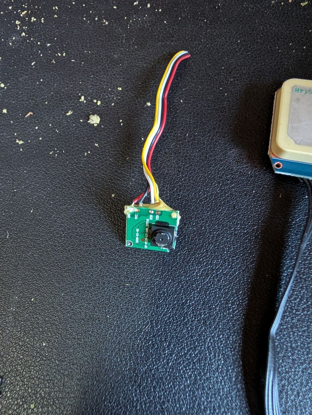 A tiny salvaged camera module with a 4-wire connector